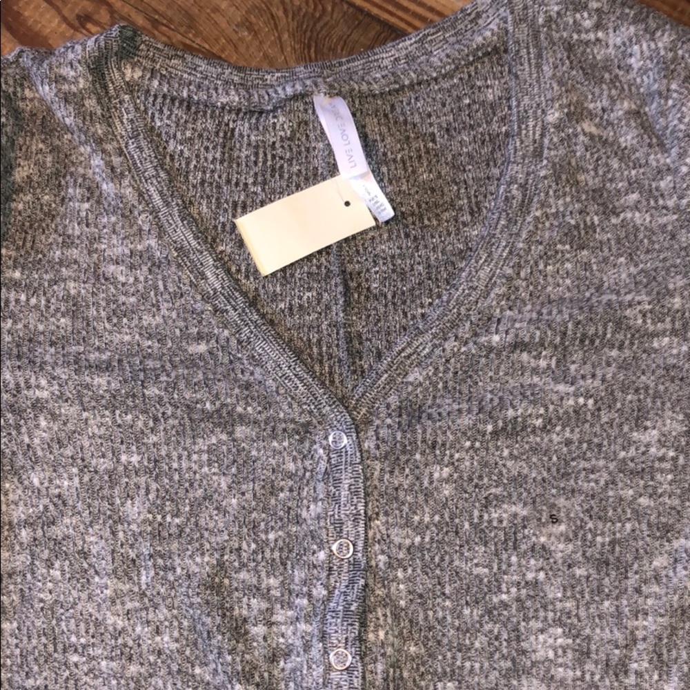 A grey sweater onesie